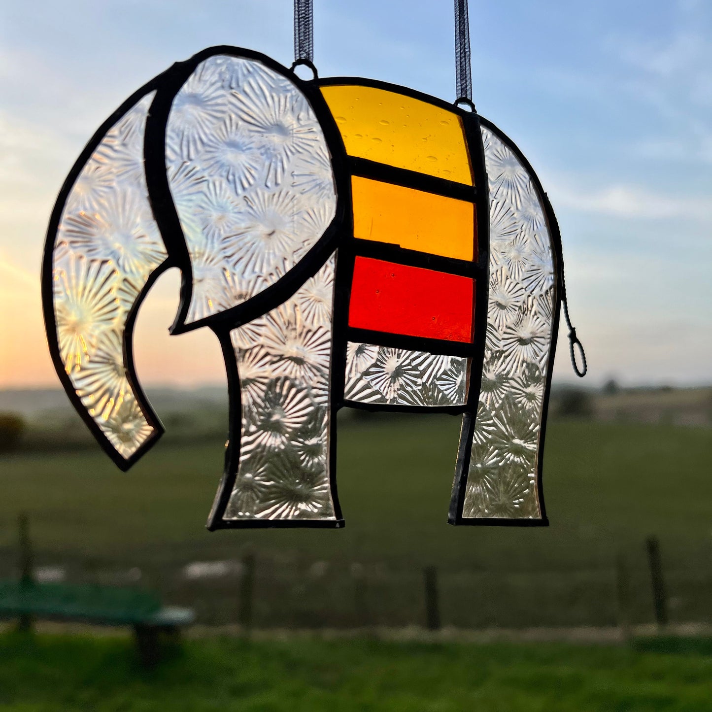 Pretty Elephant Stained Glass Suncatcher in warm golden tones with iridescent body ….