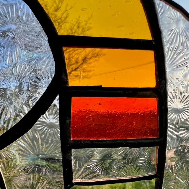 Pretty Elephant Stained Glass Suncatcher in warm golden tones with iridescent body ….