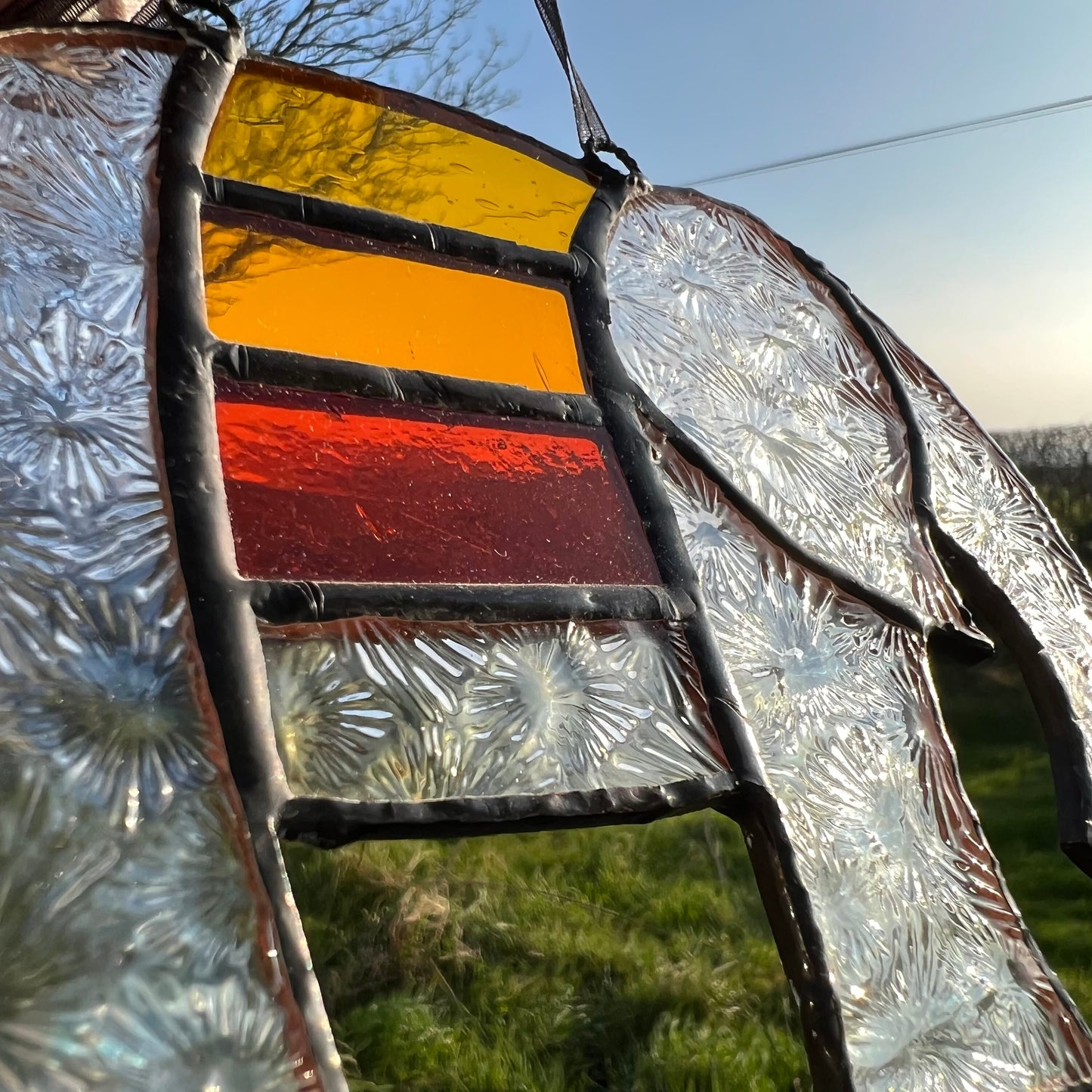 Pretty Elephant Stained Glass Suncatcher in warm golden tones with iridescent body ….