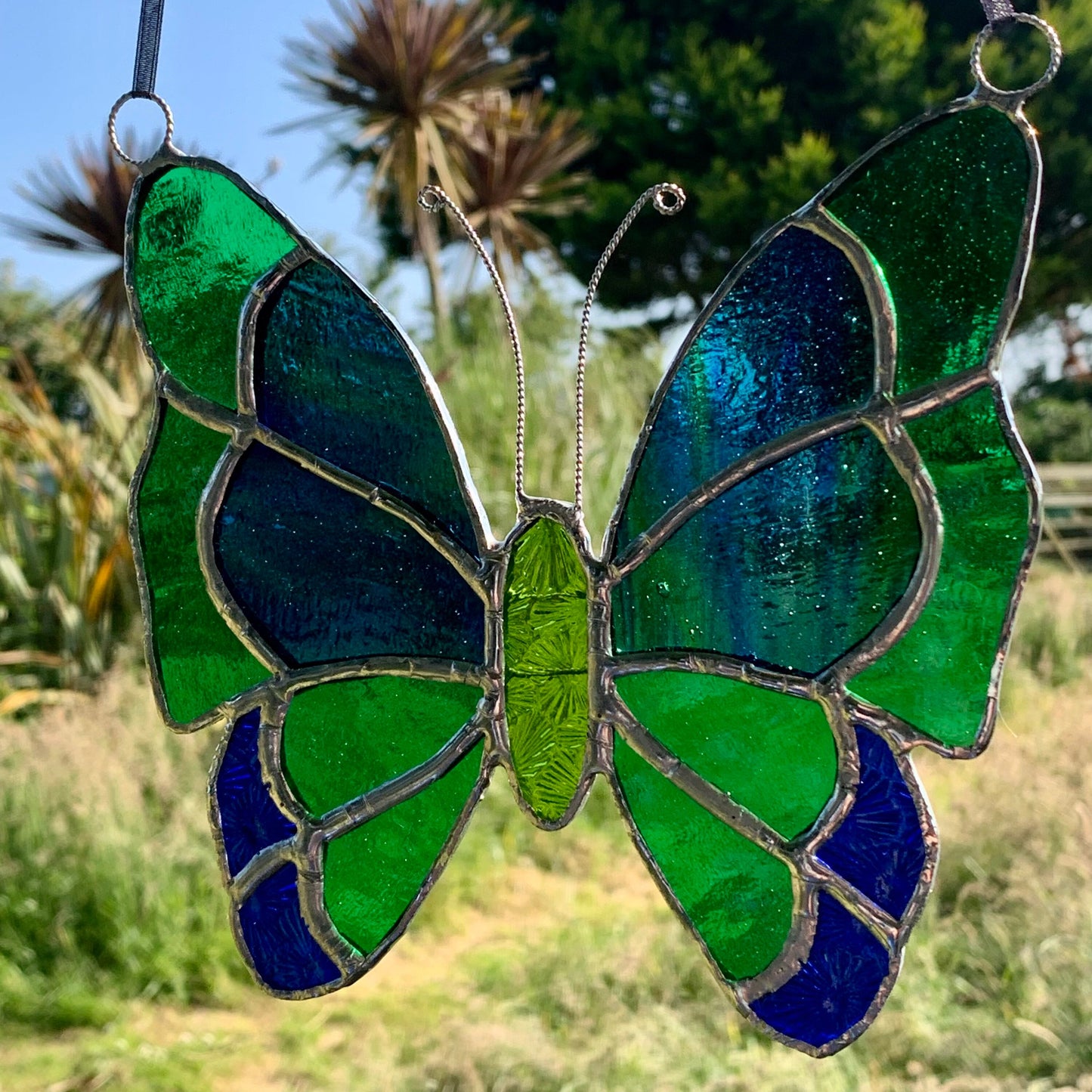 Green Stained Glass Butterfly Suncatcher: Handcrafted Window Decor