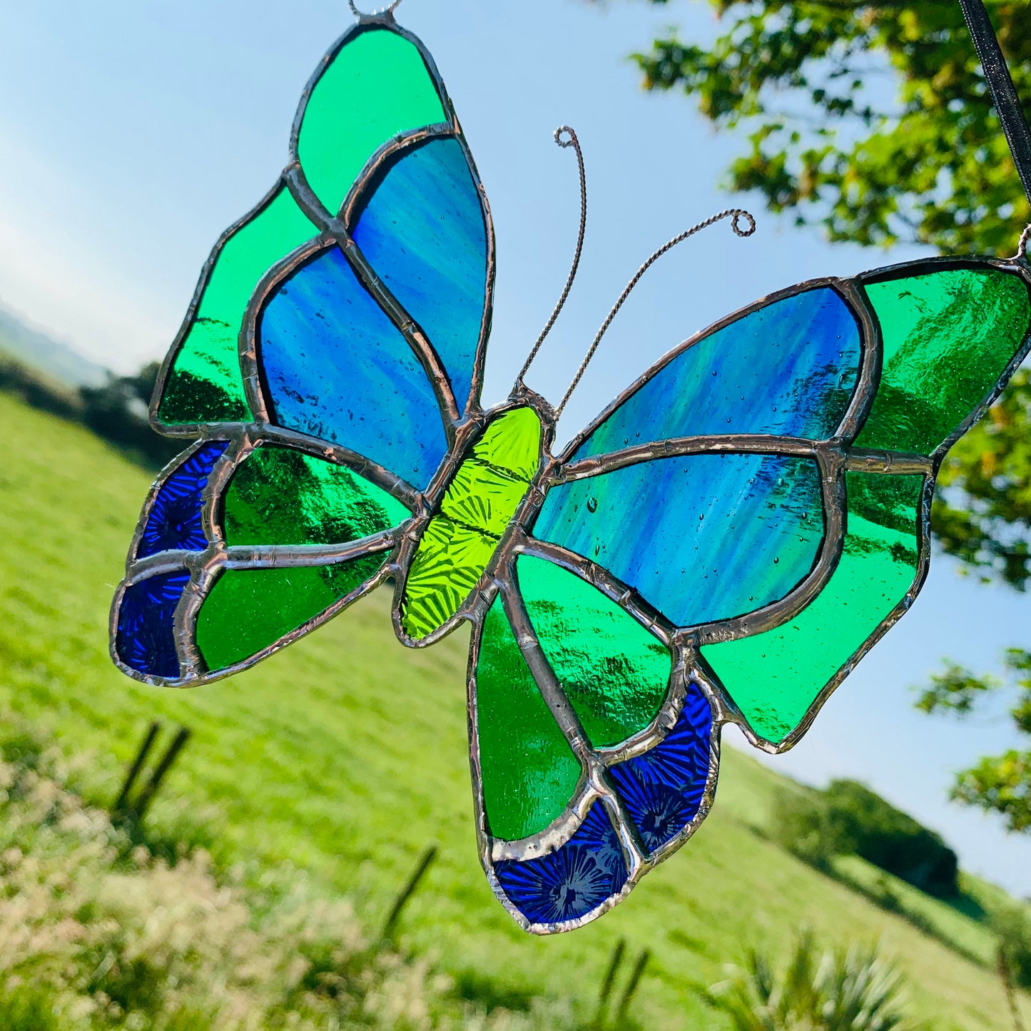 Green Stained Glass Butterfly Suncatcher: Handcrafted Window Decor
