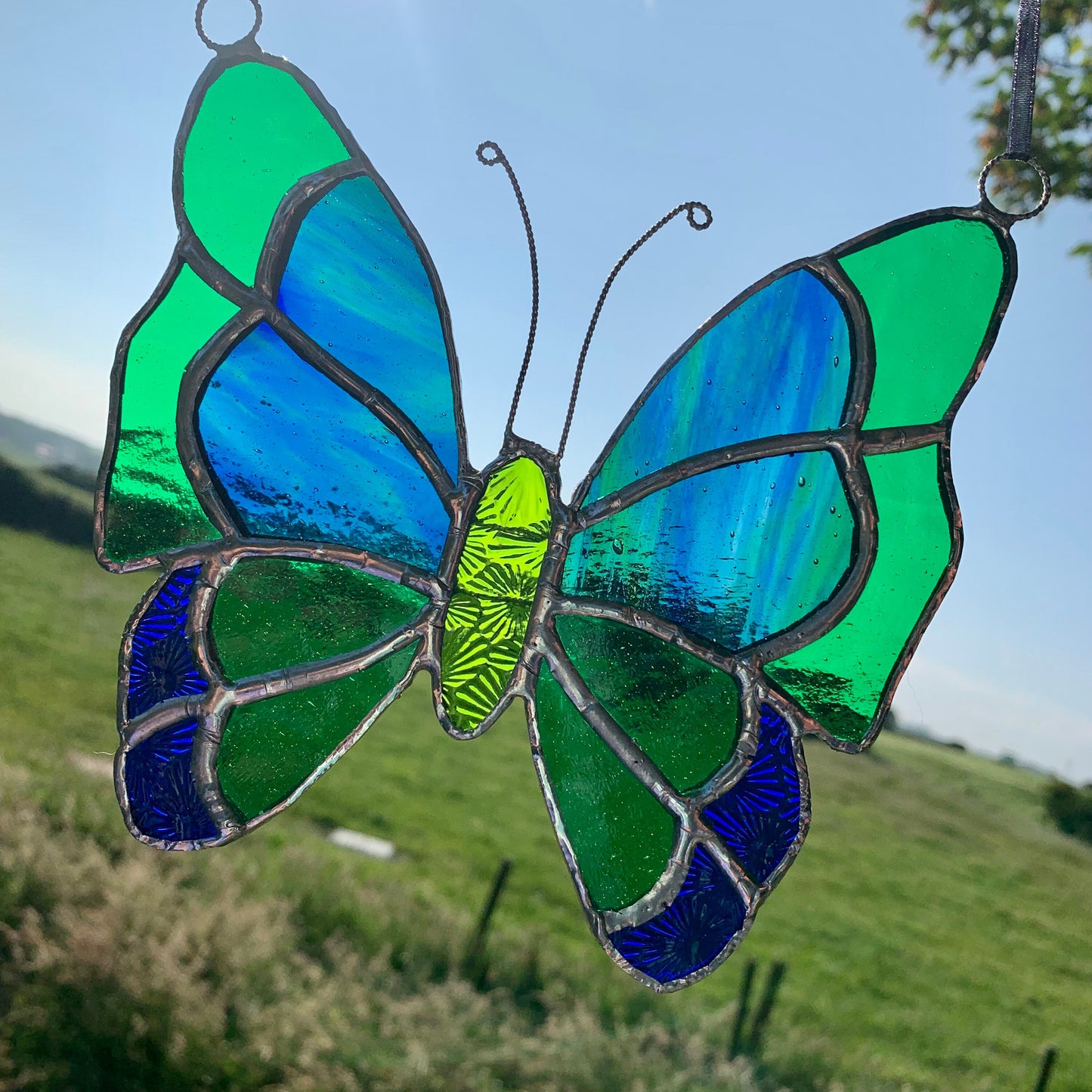 Green Stained Glass Butterfly Suncatcher: Handcrafted Window Decor