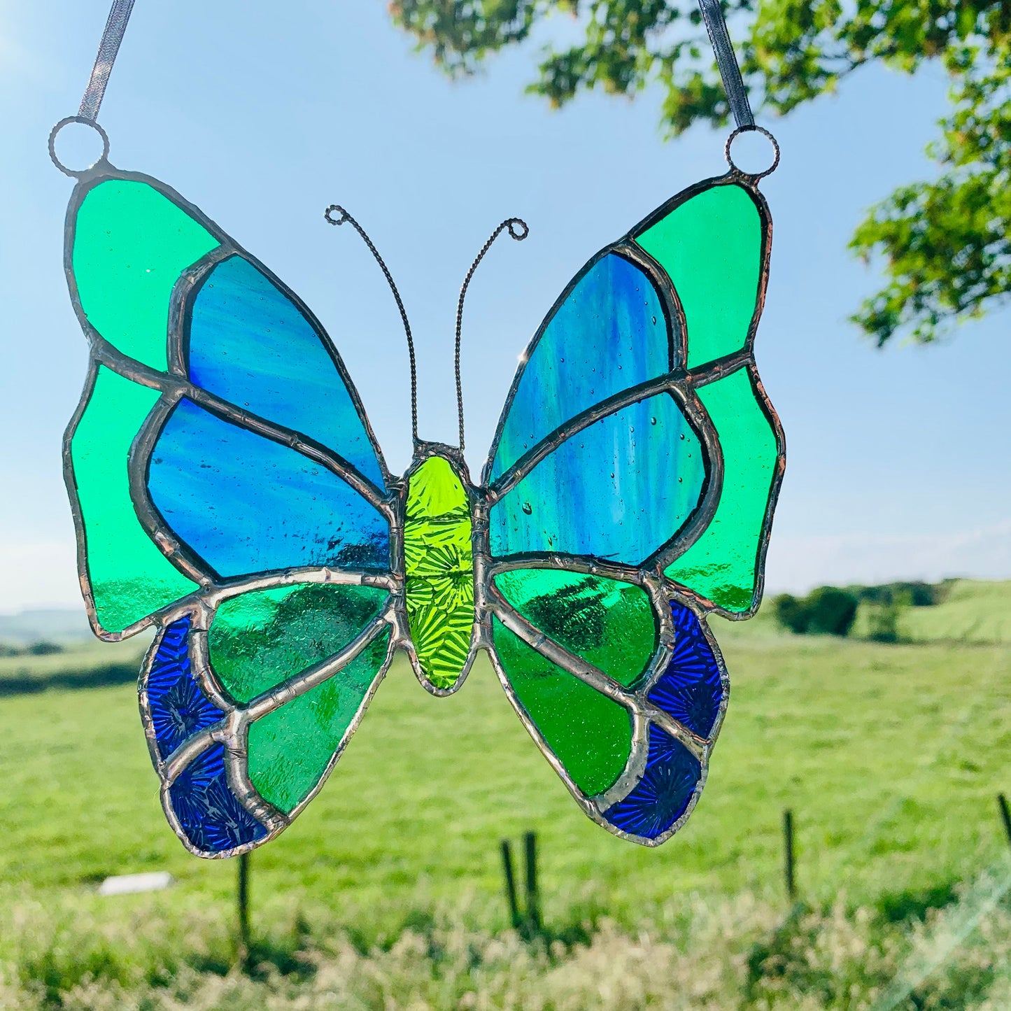 Green Stained Glass Butterfly Suncatcher: Handcrafted Window Decor